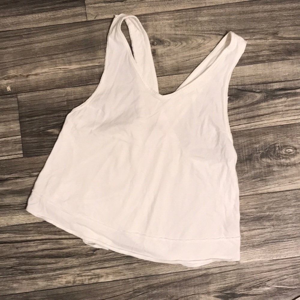 Free people white tank. We the free. Size: Large